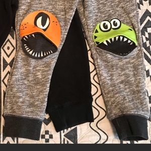 Toddler sweat pants with little monsters .